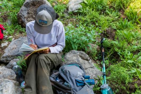 field researcher writing notes